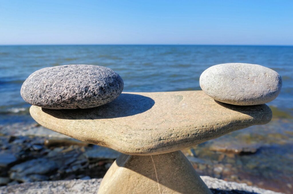 Balancing rocks on the shore of a body of water